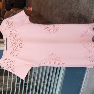 Pink Bodycon dress by T Tahari. Dress has small cutouts, form fitting.